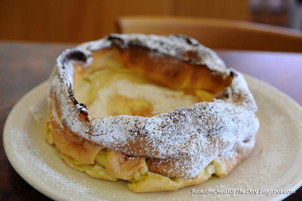 The Dutch Baby — oven-baked pancake with powdered sugar